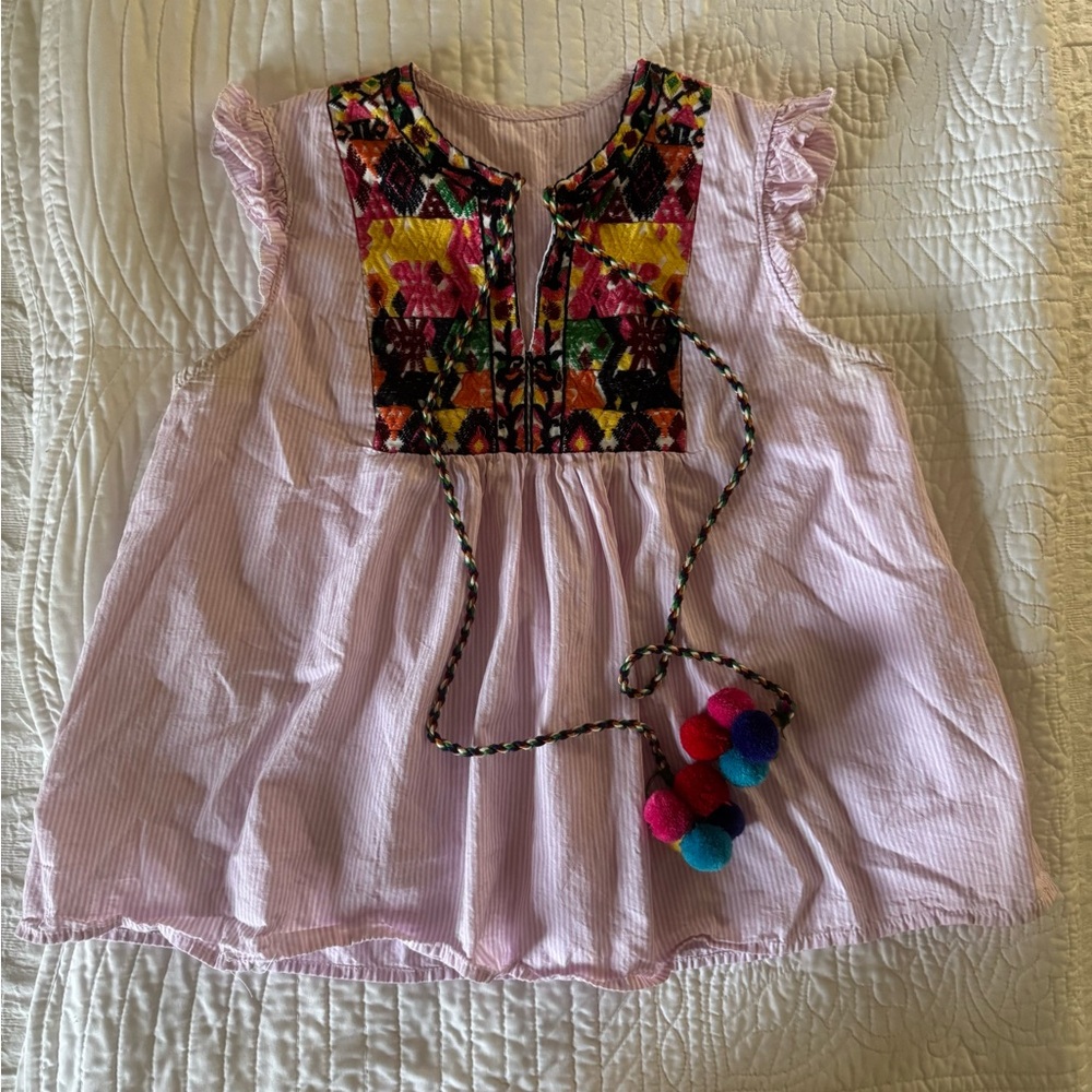 Cutest woman’s top with tassels